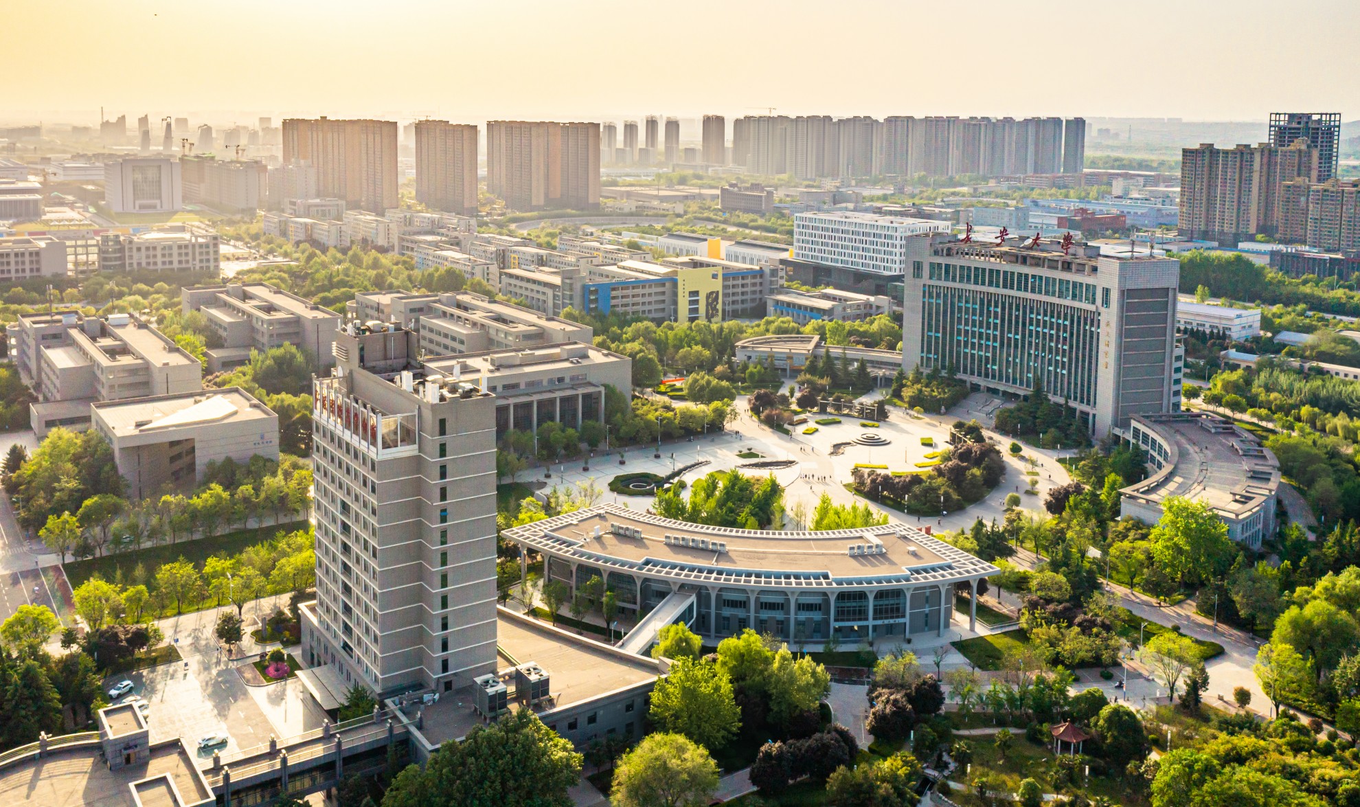 Traditional Chinese building with mountains and trees in background
