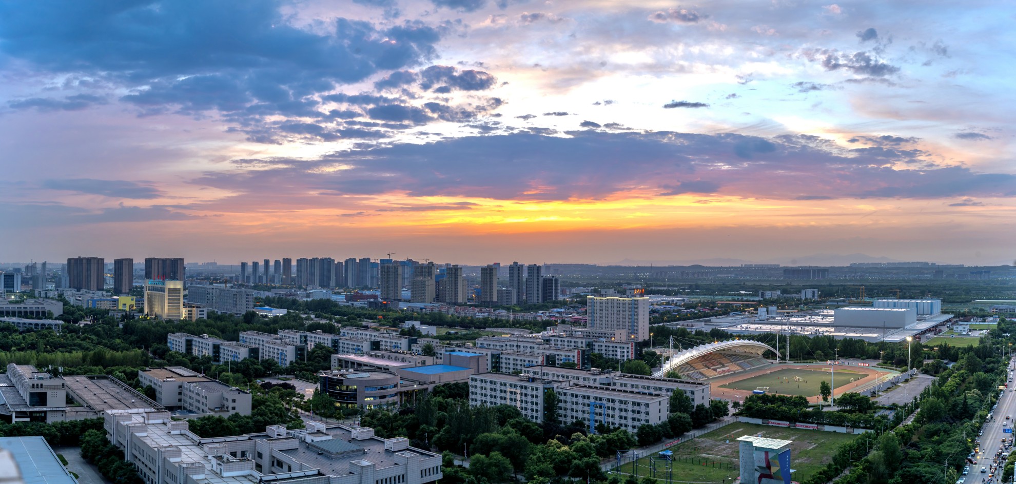 Traditional Chinese building with mountains and trees in background